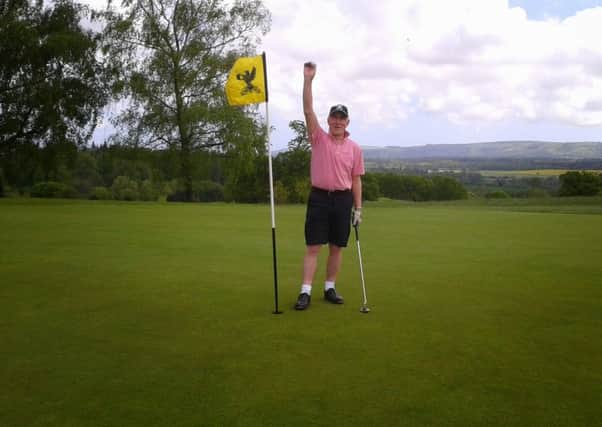 Terry Adsett celebrates his hole in one