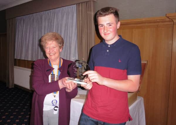 Rotary Club of Senlac President Christine Folley presents the Endeavour Award to James Goodhew SUS-150528-090535001