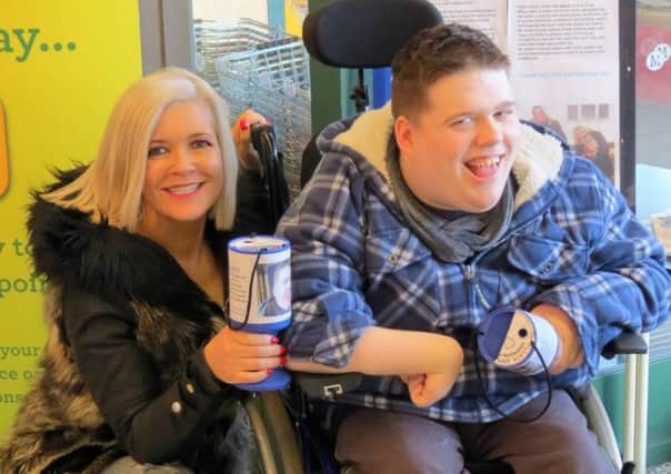 Becky and Jake Davis collecting for Jake's Splash at Morrisons SUS-150527-112730001