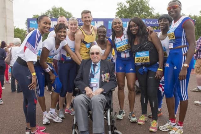 Steve Cram, 98 year old Bill Lucas and fellow Olympians celebrate after completing the Olympian Wave at the Bupa Westminster Mile 2015. Picture by Bob Martin
