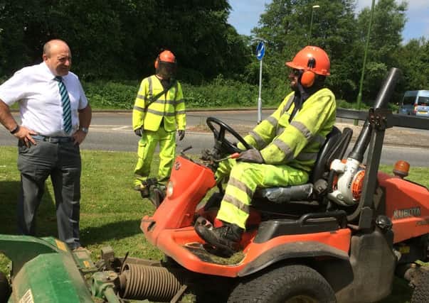 West Sussex County Council contractors mowing the grass