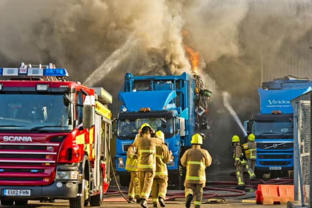 Firefighters tackle a roaring blaze at a recycling centre in Crawley   Picture: Eddie Howland
