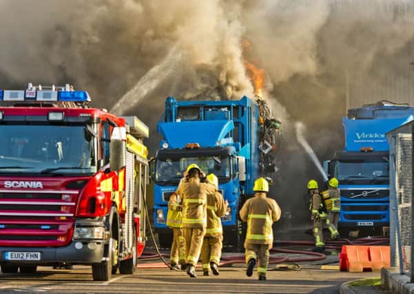 Firefighters tackle a roaring blaze at a recycling centre in Crawley   Picture: Eddie Howland