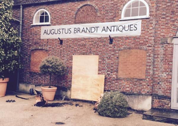 The damaged shop front at Augustus Brandt Antiques in Petworth SUS-150106-085426001