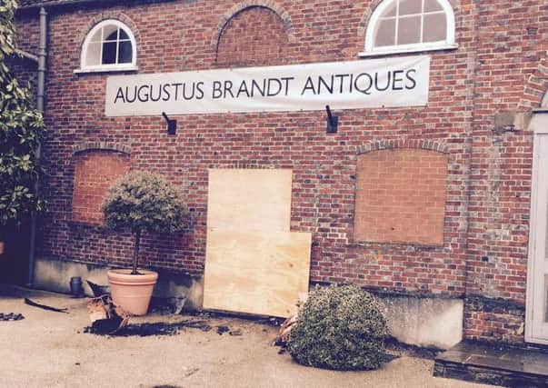 The damaged shop front at Augustus Brandt Antiques in Petworth