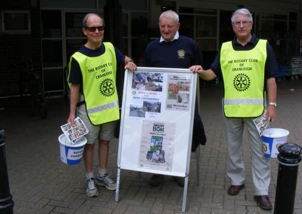 John Menlove, President of the Rotary Club of Cranleigh (centre), accompanied by Brian Vine (left) and Norman Every SUS-150106-145159001