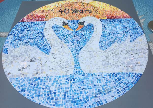 Mosaic for Swan Walk's 40th birthday SUS-150106-152500001