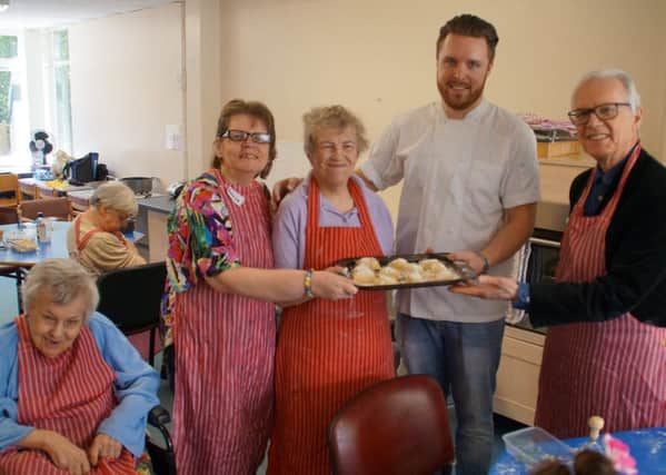 Masterchef winner Steven Edwards visits the cookery class of the Strawford Centre for people with learnindg disabilities. Pictured are some of the day guests with Steven and West Sussex County Council cabinet member for adult social care and health Peter Catchpole - picture contributed by WSCC