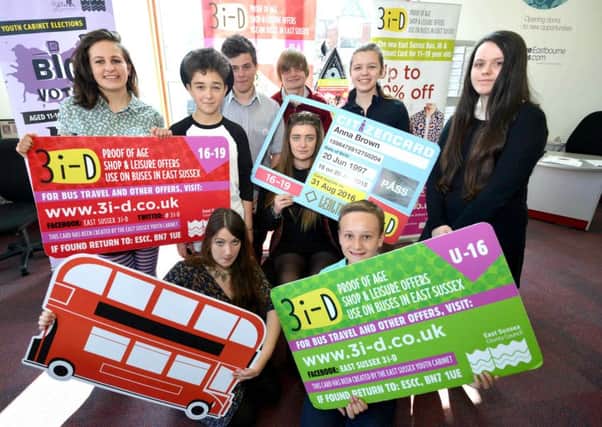 Youth cabinet members at the launch of the 3i-D card at libraries in East Sussex. Back (from left): Robin Holmes (Lewes), George Kyprianou-Hickman (Eastbourne), Nick Steer (Eastbourne), Harry Elphick (Wealden), Jess Batchelor (Coastal - face in card), Maria Goptareva (Bexhill and Hastings), Becca Barrie (Bexhill and Hastings). Front (from left): Charlotte Thomas (Bexhill and Hastings), Jack Foley (Wealden) SUS-150106-164500001