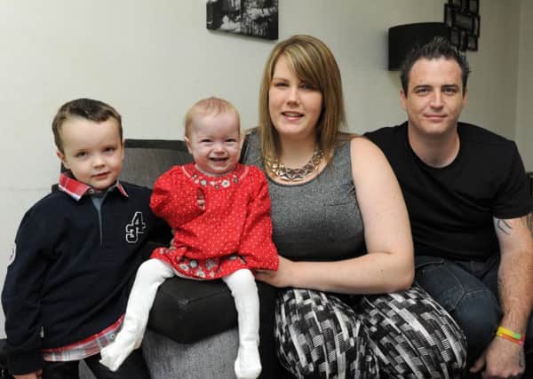 Parents Dan Sapio and Cara Hunter with their children Harvey, four, and Grace, who died three months before her second birthday