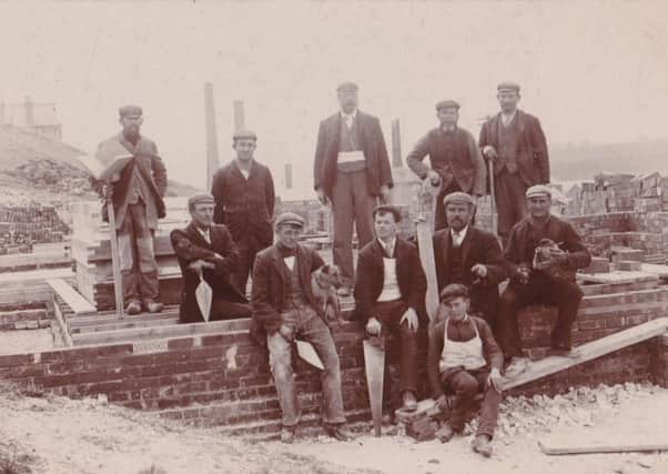 Walter Frederick Elms is seated second from right. His first son, Frederick, is stood on the far right of the back row, and his other son, Ted, is seated on the left, holding a little dog