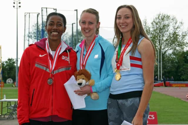 Elise Lovell (centre) on the top step of the podium after winning the senior womens heptathlon at the England Athletics Combined Events Championships
