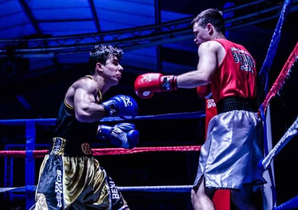 Tam Nabizada (left) in action for Bexhill Amateur Boxing Club