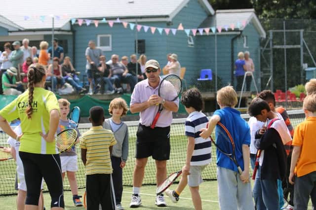 Danny Sapsford leads a coaching session with junior players at Amherst LTC in Hastings