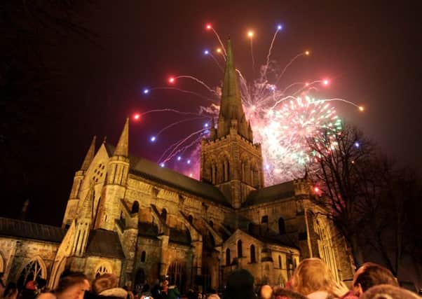 Light fantastic - The Cathedral spire looking stunning as a backdrop to the fireworks    Picture by Louise Adams C131544-2 Chichester exmas lights ENGSUS00120130112144908