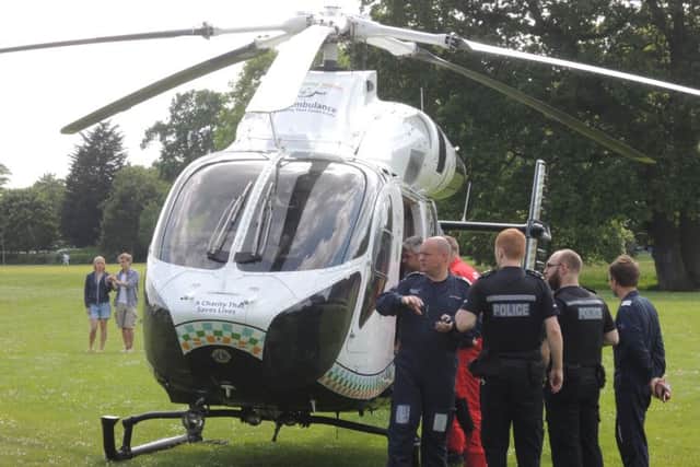Air ambulance in Horsham Park SUS-150706-162558001