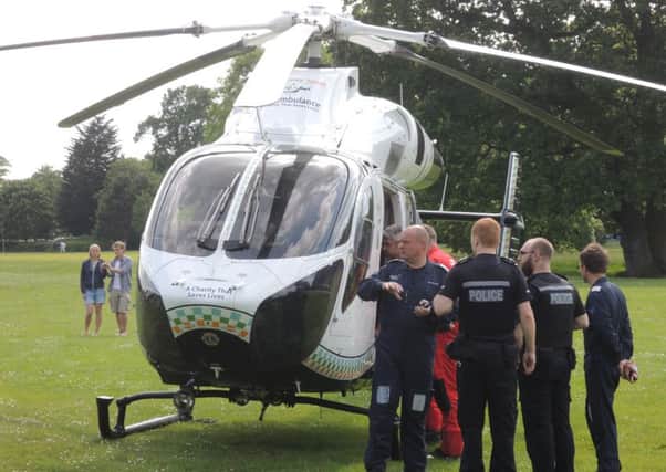 Air ambulance in Horsham Park SUS-150706-162558001