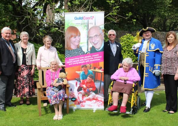 Pictured are Mayor Michael Donin, Mayoress Linda Williams (left of banner, with residents), and Percy Nowell, Worthing town crier, Bob Smytherman and Caer Gwent manager, Leona Cameron (right of banner, with resident)