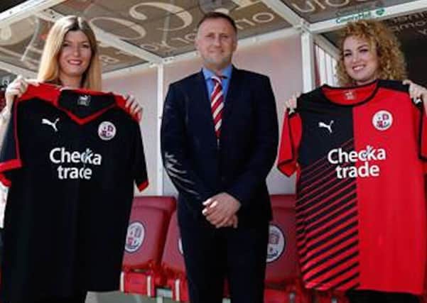 Crawley Town manager Mark Yates displays their new kit sponsored by Checkatrade.com SUS-150106-205425002
