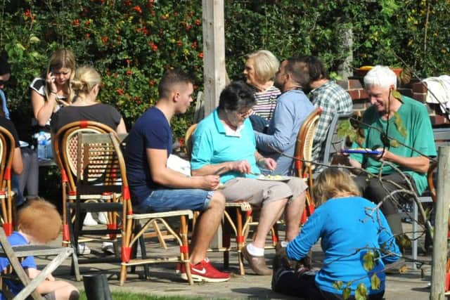 Mary Berry, crew members and gardeners stop for lunch at the Tangmere Community Garden last September. Picture by Kate Shemilt C140918-2