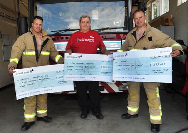 Steyning Fire fighters Richard Poole and Danny Flynn with Richard Broady from Fire fighters charity (Pic by Jon Rigby) SUS-150906-124840008