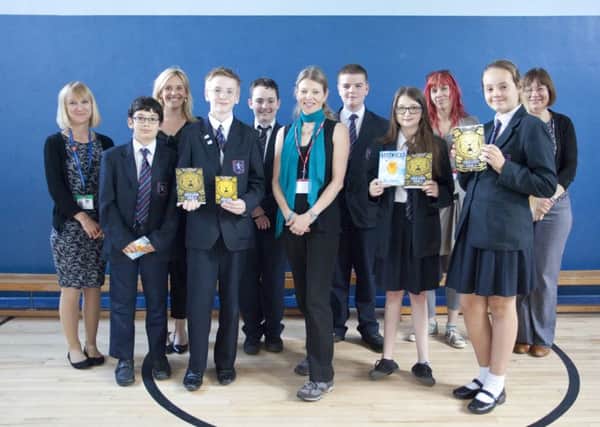 Students Cameron Lewis, Dylon Reed, Jack Packham, Kaii Scadding Hunt, Lily Wells, Kimberley Lainsbury with teachers and author Ruth Eastham SUS-150906-151203001