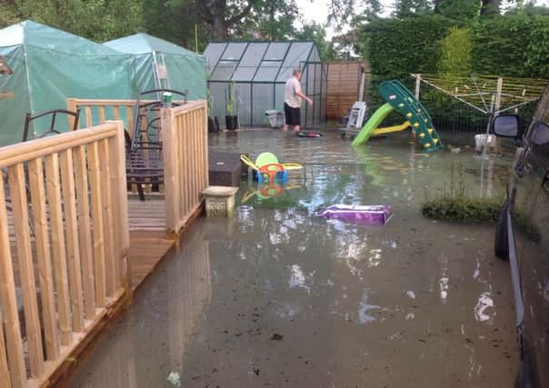 A burst water main in Broadwater flooded gardens in Northbrook Close