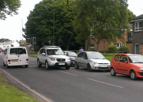Parked cars in Spitalfield Lane