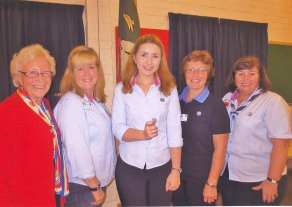 Celebrating the recent Queens Guide Award achievement, from left, Pat Ware, Paula Hellyer, Lauren Phillips with her special badge, Suzie Hellyer and Debbie Phillips