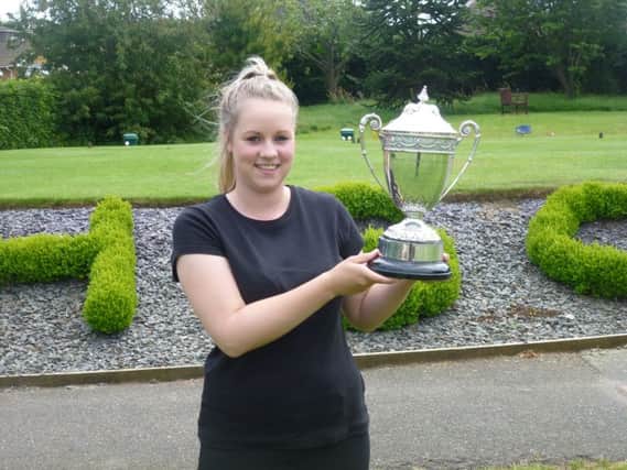 Sussex ladies' golf champion Chelsea Masters clutches the trophy. Picture by Simon Newstead (SUS-150506-164649002)