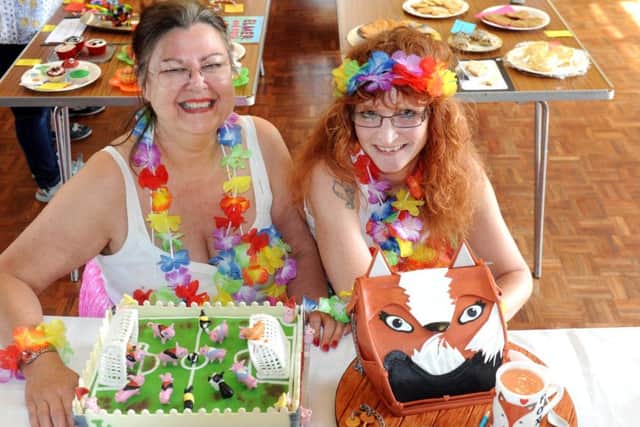 Deborah Harwood, right, who won first prize with her cake entry, Foxy Lady, and Ann Arnold who came second wiith her entry of Five a Side.ks1500207-11 SUS-150614-083135008