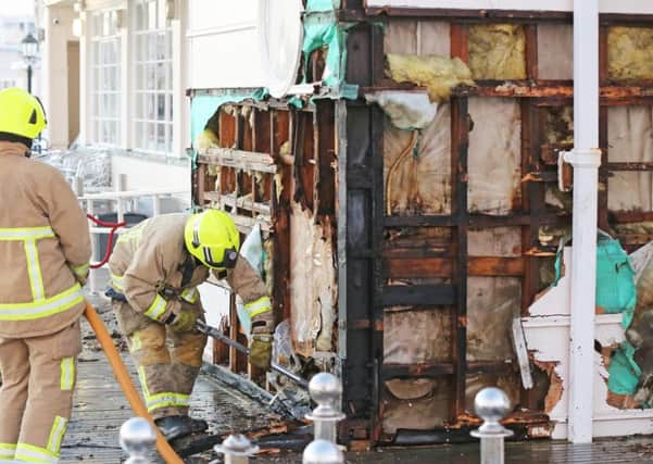 Firefighters tackling the blaze at Worthing Pier SUS-150613-230619001