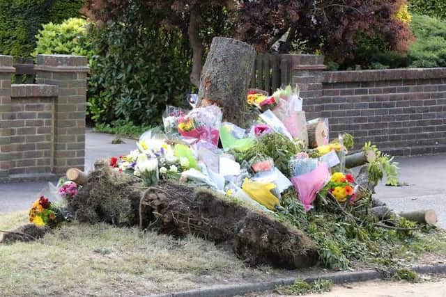 Flowers and messages at scene of crash