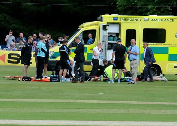 Henriques and Burns are treated on the field
