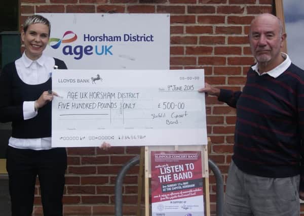 The Bands publicity officer, Chris Youngman, is shown here handing overthe cheque to Janice Leeming, Chief Executive Officer of Age UK Horsham District SUS-150615-104920001