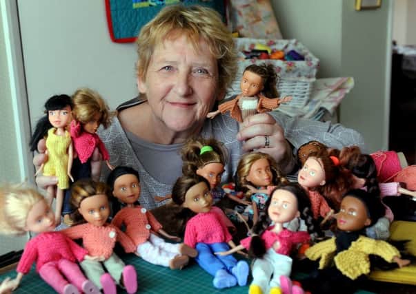 Jeannette Sutton surrounded by the restyled Bratz dolls PICTURE BY KATE SHEMILT kks1500212-1 SUS-150615-182734008