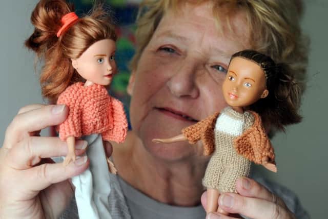 Jeannette Sutton with the dolls she has restyled PICTURE BY KATE SHEMILT 1500212-2 SUS-150615-182722008