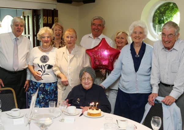 102-year-old Grace Biggs with fellow bridge players at the clubs dinner DM1505215a