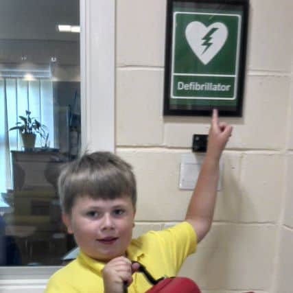 Henry Strong with the new defibrillator