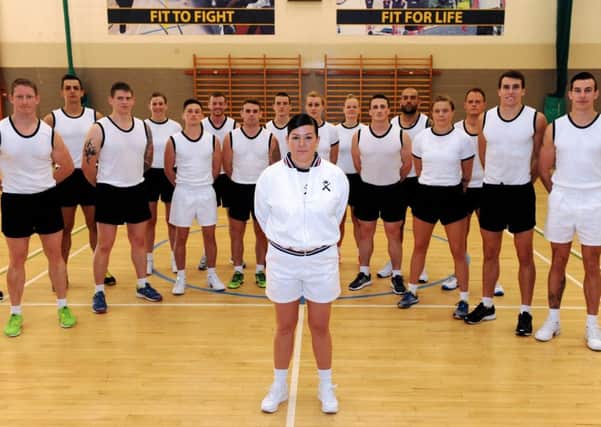 Petty Officer Physical Training Instructor Donna Chapman with members of the PT course      Picture: LA(Phot) Guy Pool