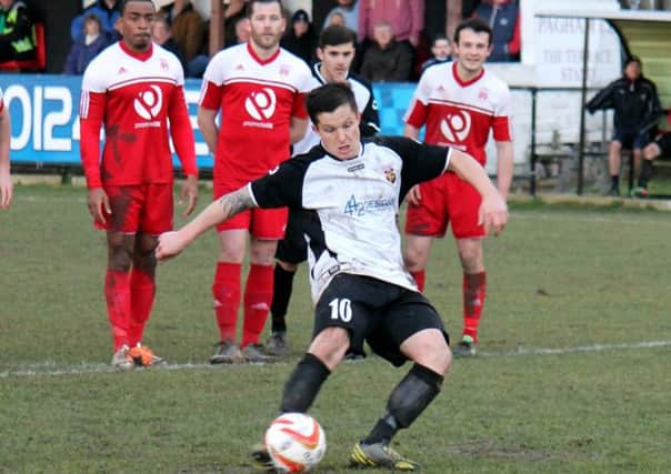 Scott Murfin takes a Pagham penalty / Picture by Roger Smith
