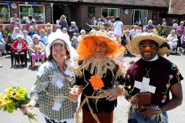 Fiona Doughty, the scarecrow bride, Michael Cooper, the scarecrow groom, and 'vicar' Tom Longland