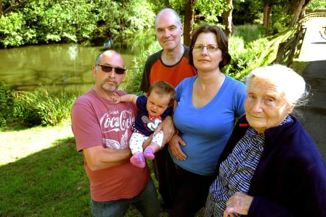Two lakes in Ayshe Court Drive could run dry after a leak was discovered. They have no council support and are pushing for funds for sandbags. Nigel Cawston, Richard and Alison Bryant and Bill Putbrace. Pic Steve Robards SR1514415 SUS-150623-141850001
