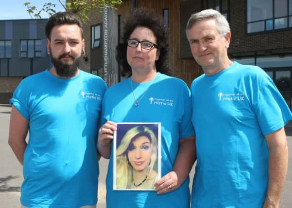 Shocked: The parents and brother of Jo-Anne Goldring, 16, who died dm1511119a