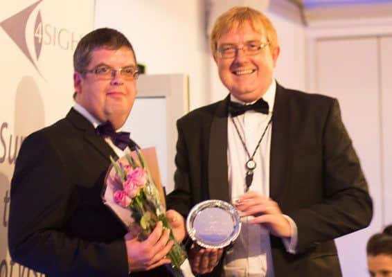 Darren Baker receives the Community Partnership Award