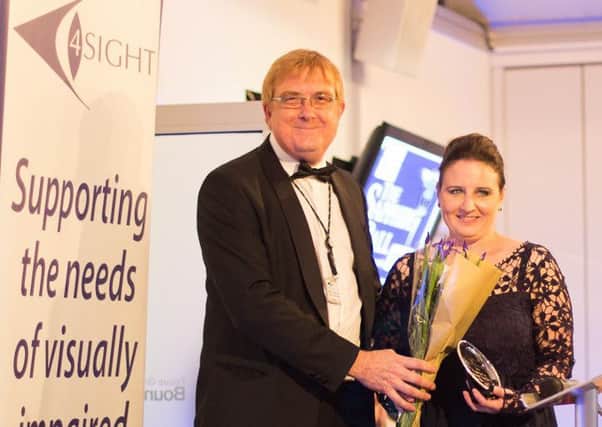 Kirstie Thomas receives the Community Fundraising Award from chief executive Martin Pearson