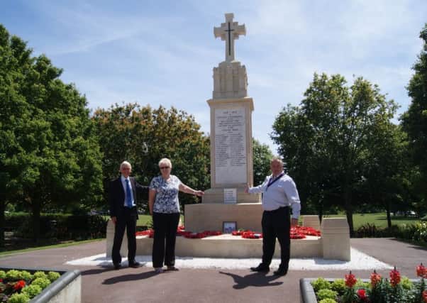 Councillors stand by Littlehampton's memorial which has received a facelift SUS-150207-105601001