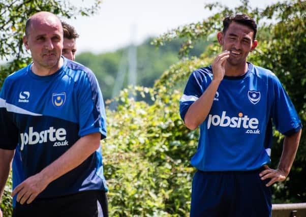 Pompey boss Paul Cook, left, and Gary Roberts Picture: Colin Farmery