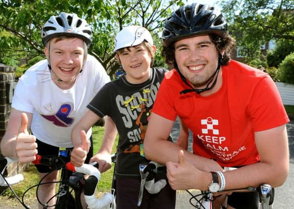 Euan McCormack with Ross and Tom Clarke. Charity cycle ride in France. Pic Steve Robards SR1514807 SUS-150630-133959001