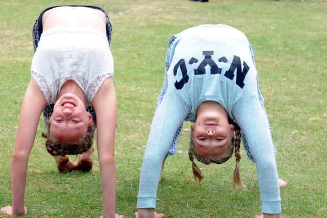 Daisy May Jones, 12, and Annie Rose Mitchell, 12, showing their gymnastic skills ks1500247-6 SUS-150629-061542008